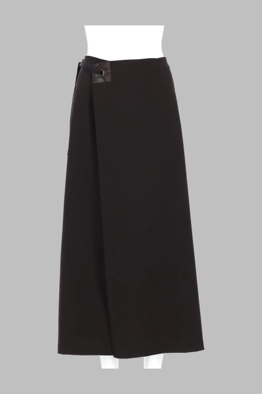 Black wrap skirt from paloma wool with sleek minimalist design and subtle metallic button detail at the waist