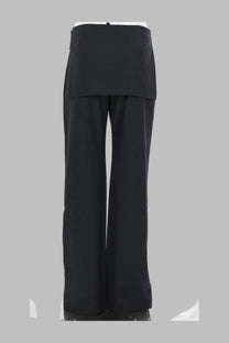 Black wide-leg trousers with layered asymmetrical skirt overlay at waist from paloma wool women’s pantalone archive grey collection