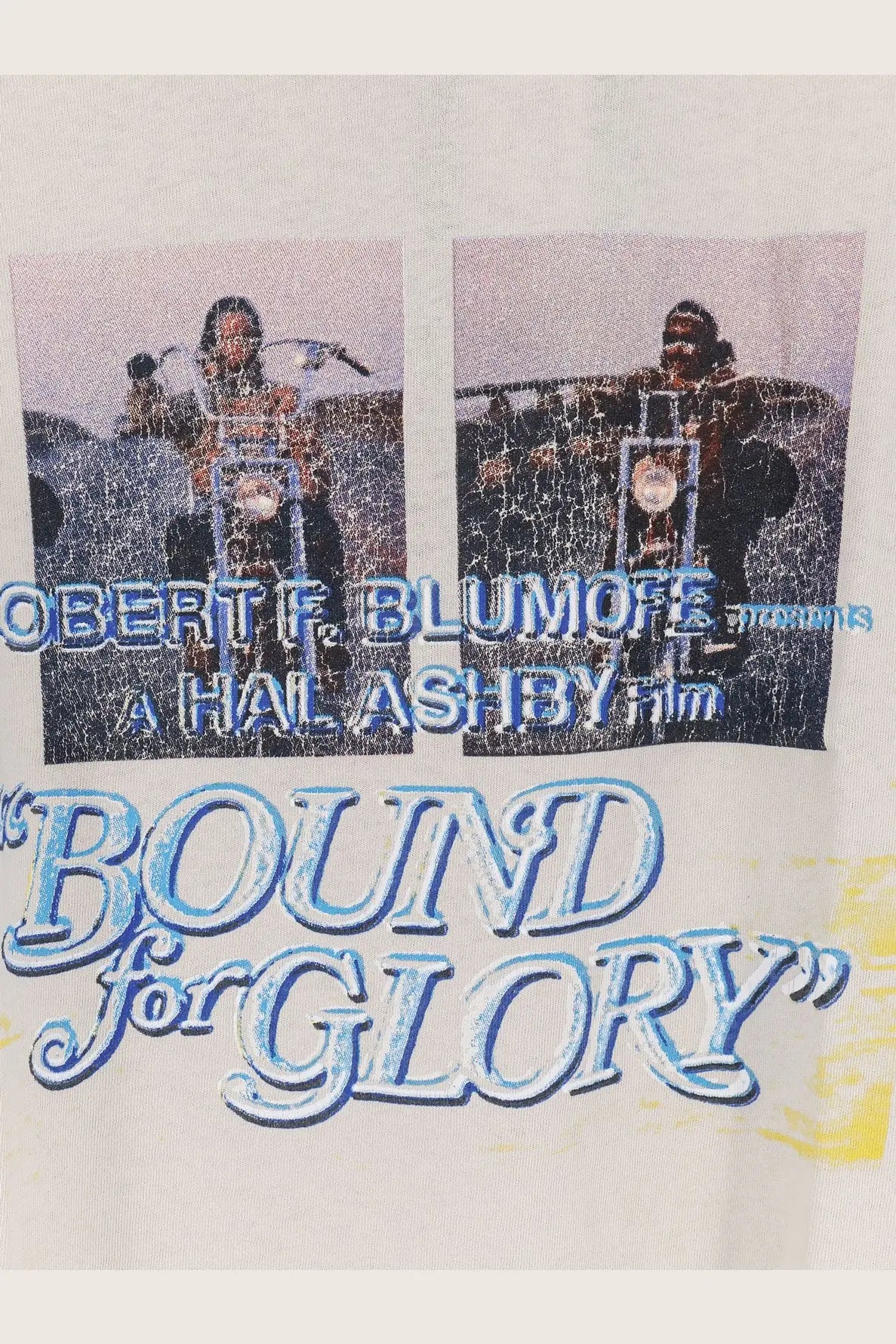 Off-white cotton t-shirt with distressed graphic of two men on motorcycles and bound for glory lettering in blue