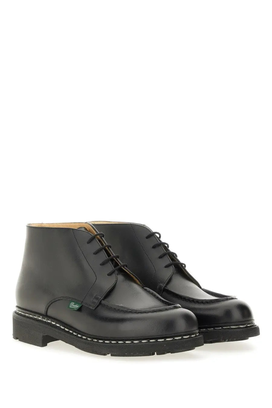 Paraboot men’s black leather lace-up ankle boots with classic brogue design and white stitching along the sole