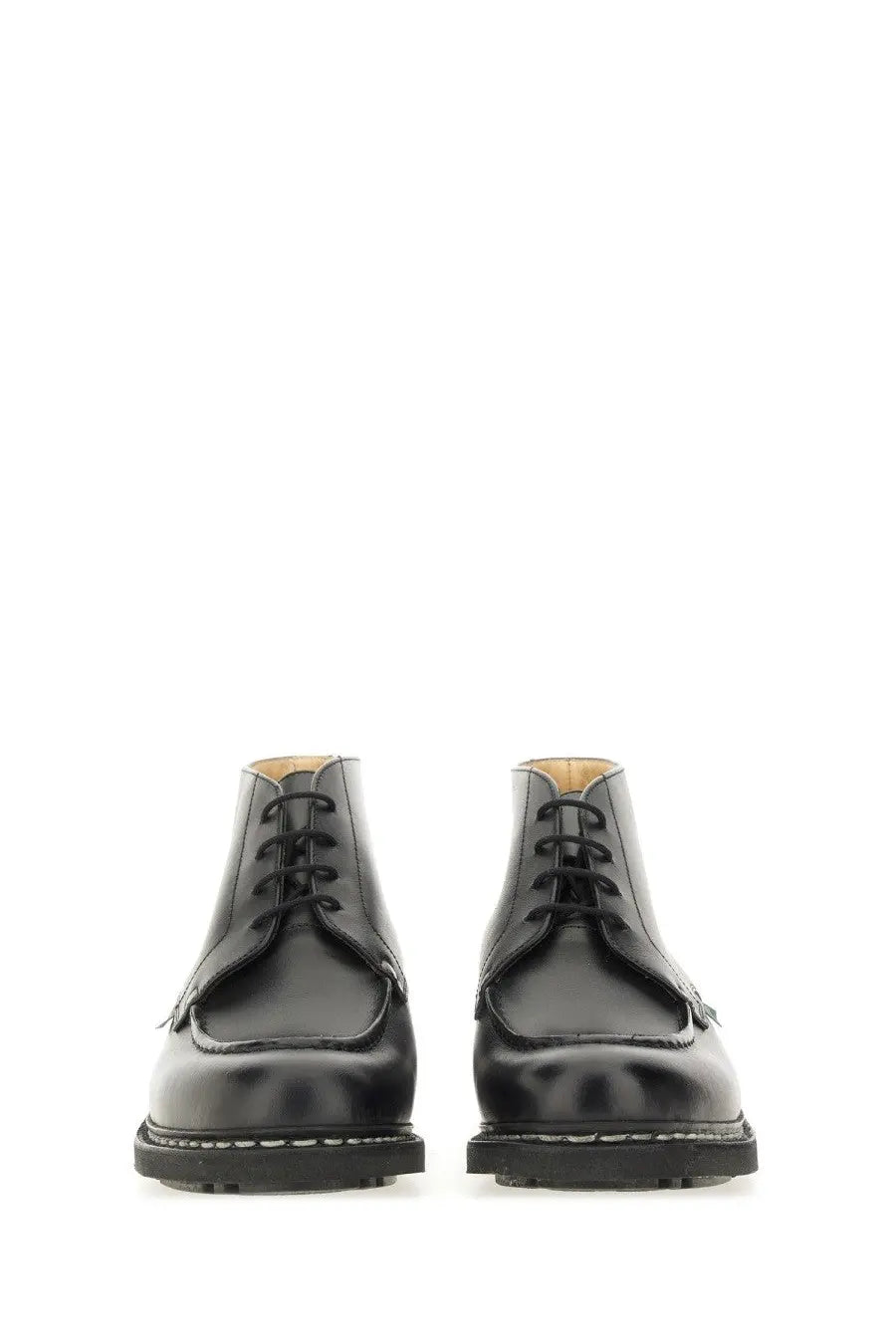 Paraboot men’s black leather chukka boots with polished finish and white stitching along the sole