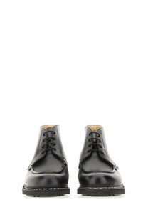 Paraboot men’s black leather chukka boots with polished finish and white stitching along the sole