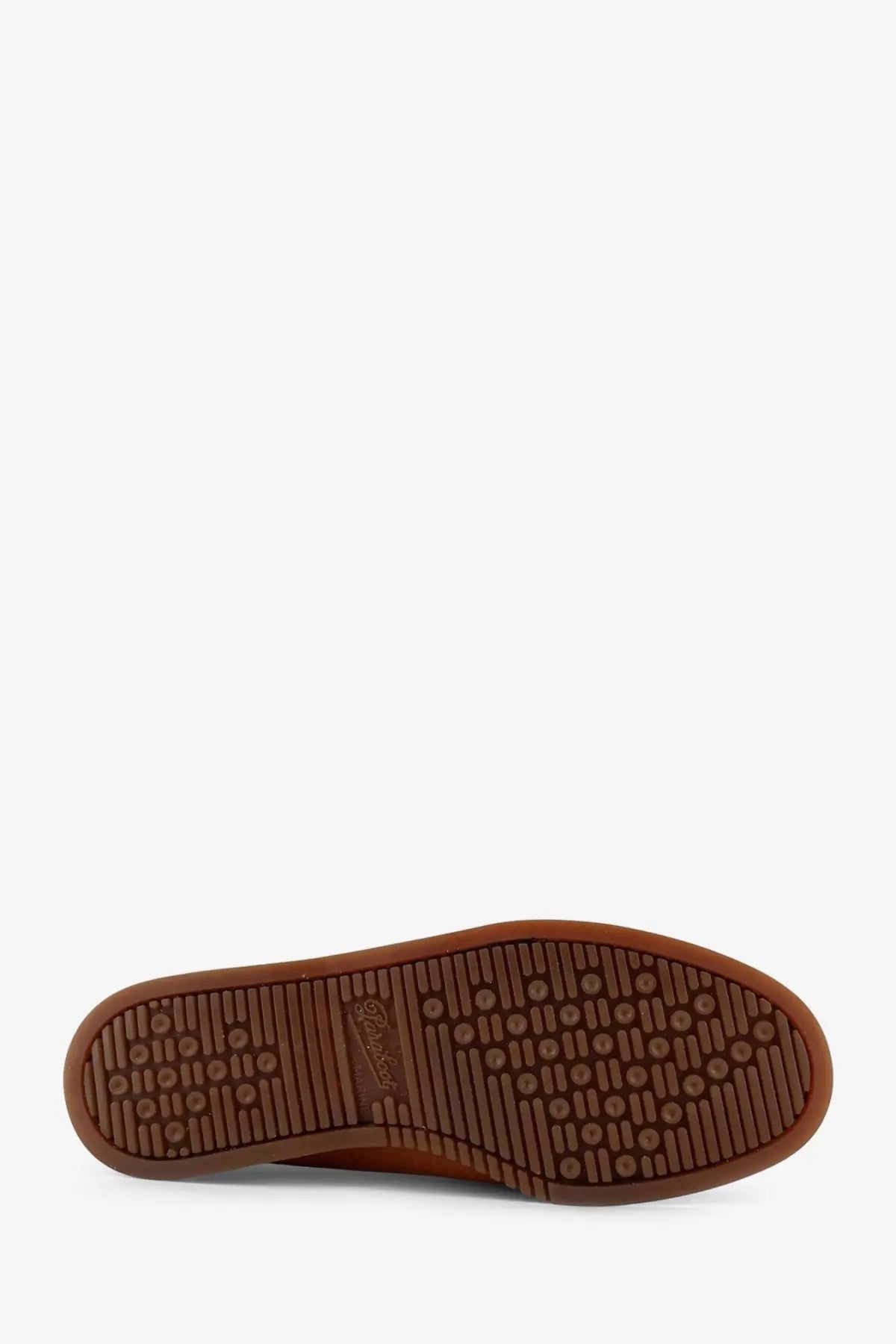 Brown rubber sole with textured pattern and embossed Paraboot logo on Paraboot men’s leather loafers miel