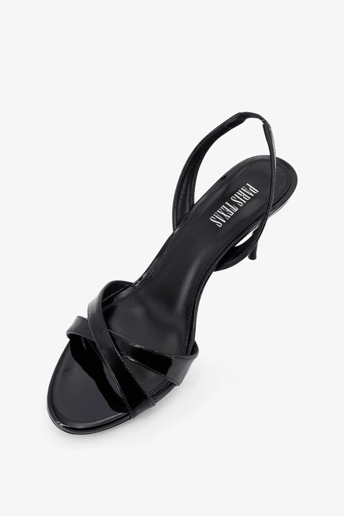 Black patent leather slingback sandal with glossy finish and thin straps from paris texas women’s lidia collection