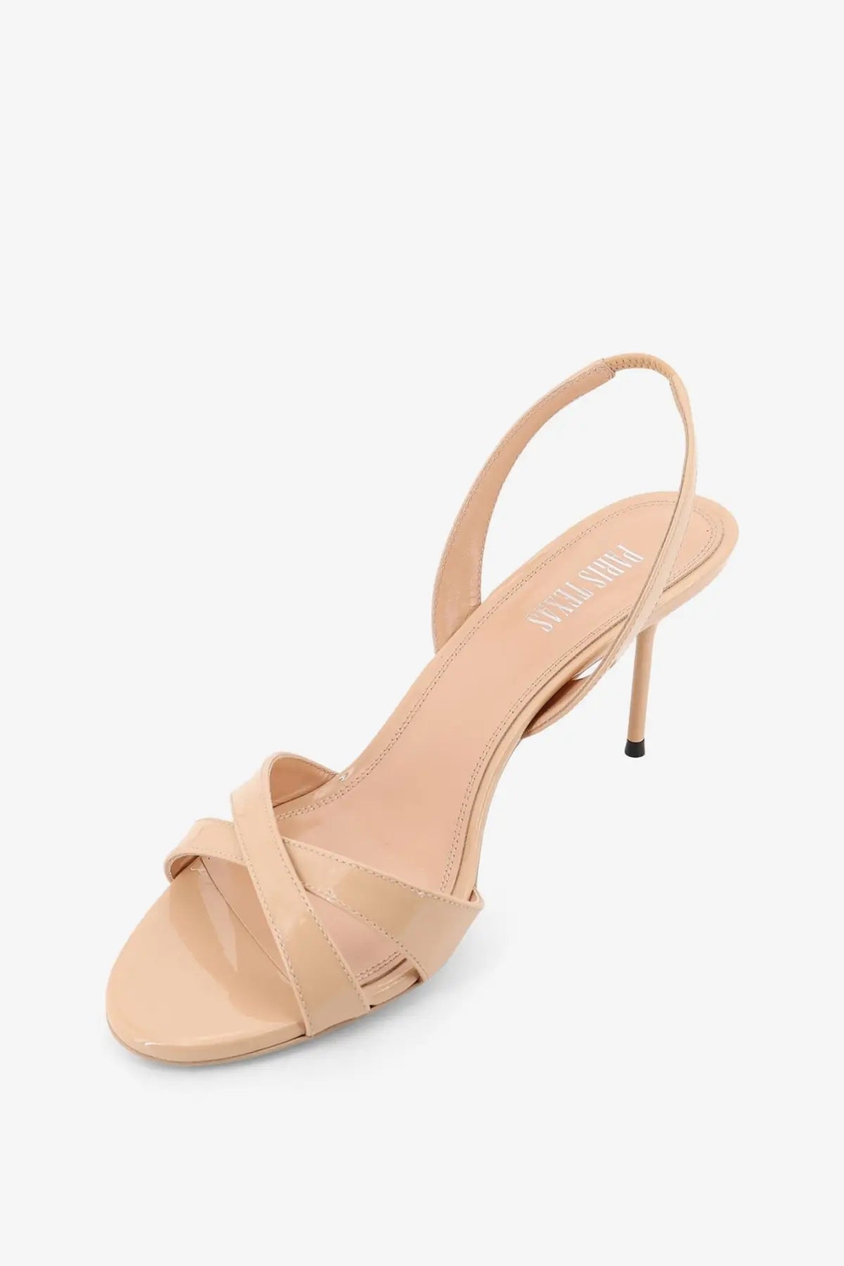 Beige patent leather strappy sandal with slender heel and ankle strap from Paris Texas women’s Lidia collection