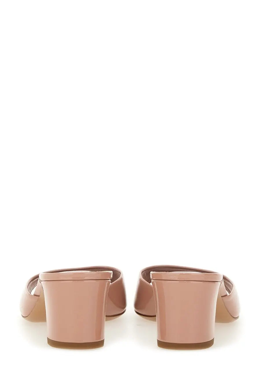 A pair of paris texas women’s sandalo lara pink nude patent leather mules with block heel and open back design