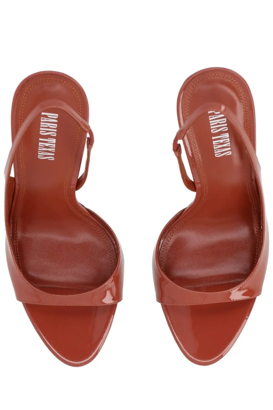 Burgundy patent leather slingback heels with a glossy finish and paris texas brand name embossed on the insole
