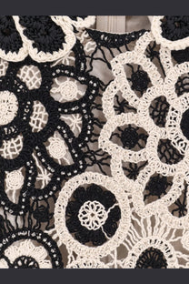 Patbo women’s crochet mini dress in black featuring cream crochet lace with beaded floral motifs