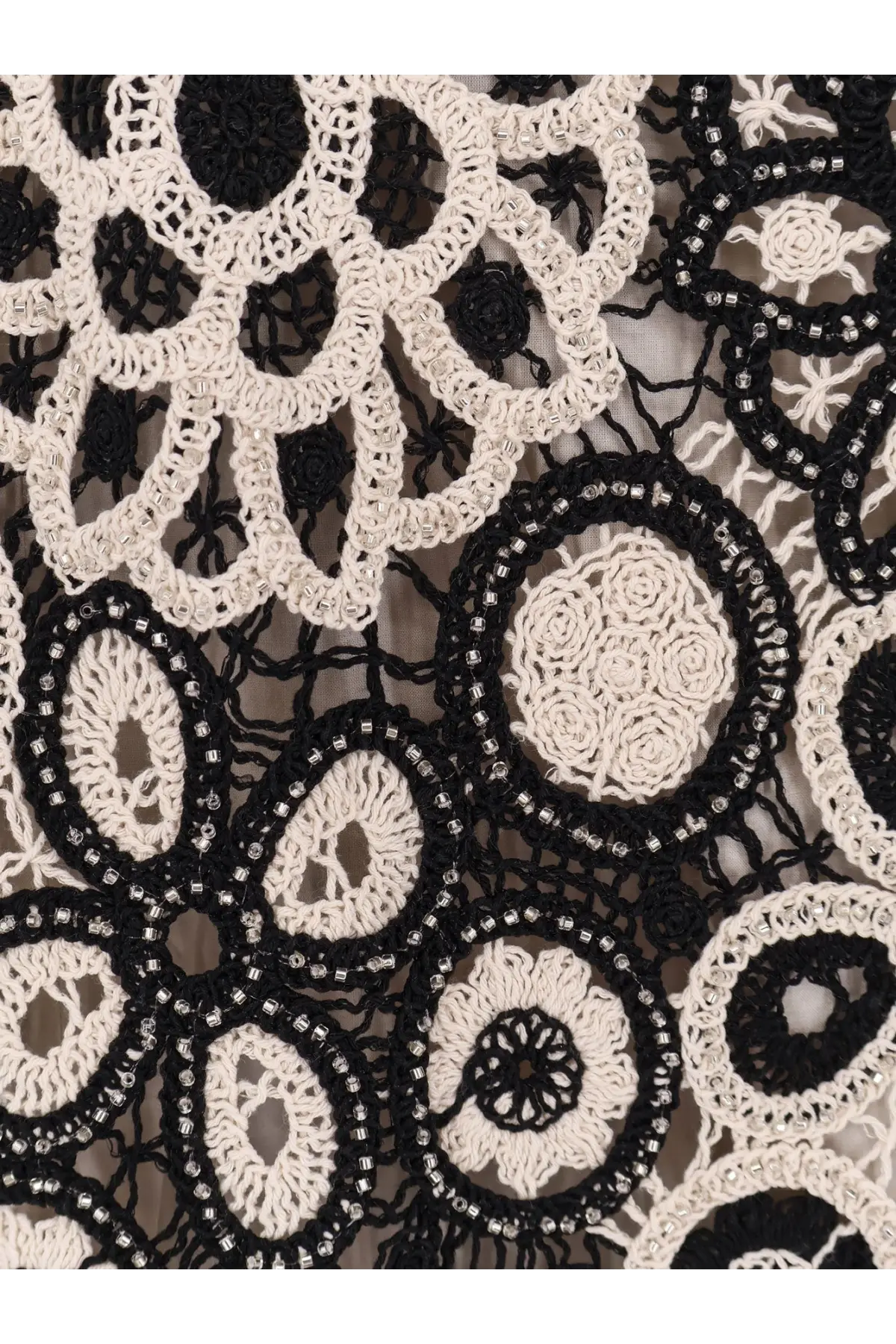Patbo women’s long crochet dress in black featuring black and cream crochet lace with beaded detailing