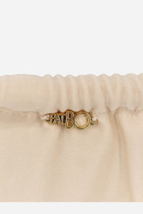 Gold-tone metal pabo tag on the elastic waistband of beige satin Patbo women’s lycra bikini bottoms white