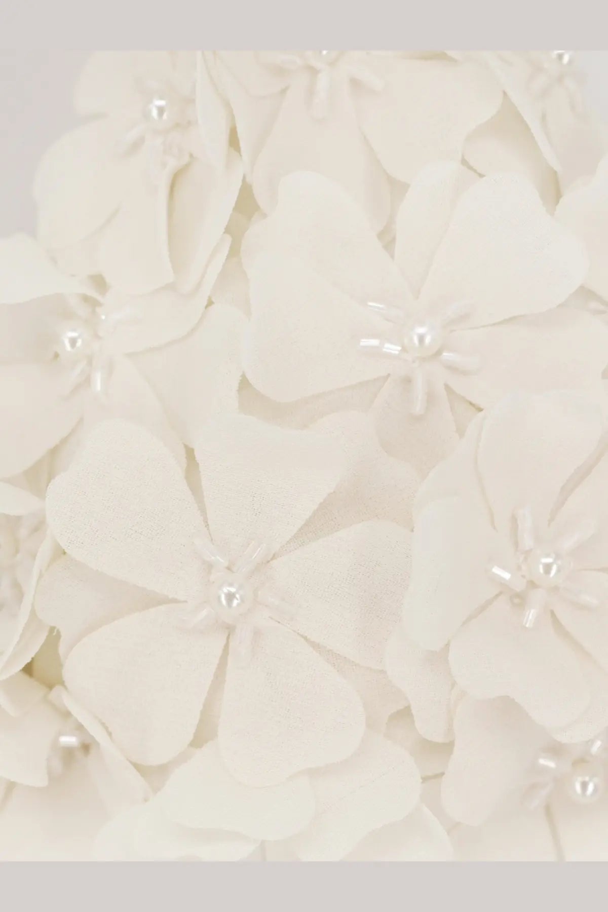 Patbo women’s white lycra bikini top featuring delicate ivory fabric flowers with tiny pearl centers