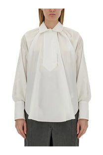 Patou women’s white cotton blouse featuring a crisp button-up style with a tie-front design and puffed sleeves