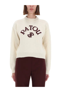 Cream-colored knit sweater with patou embroidered in dark brown across the chest for women