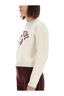Cream-colored knit sweater from Patou women featuring a maroon embroidered logo on the chest