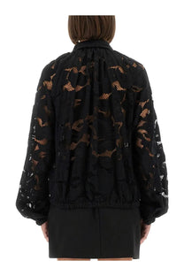 Patou women’s black lace balloon blouse with intricate floral patterns and puffed sleeves in lace fabric
