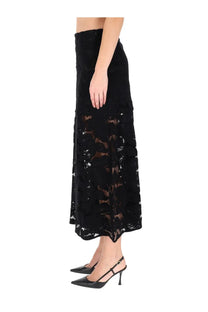 Patou women’s black lace midi skirt with intricate floral patterns and flowing elegant silhouette