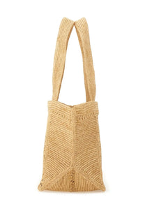 Beige woven straw patou women’s large trapeze tote bag with ribbed texture and geometric patterned detailing