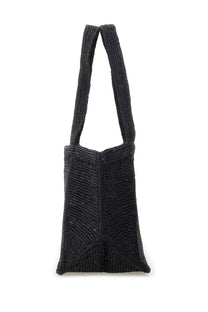 Black Patou women’s large trapeze tote bag with woven textured ribbed straps and body for stylish carrying