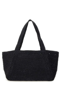 Black woven tote bag with textured braided handles and subtle decorative stitching for patou women’s large trapeze tote bag blue