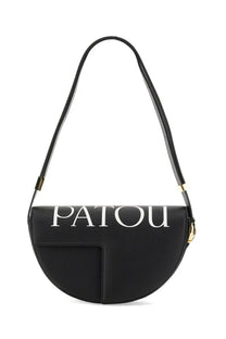 Black Patou leather half-moon shoulder bag with white lettering and gold-tone hardware for women