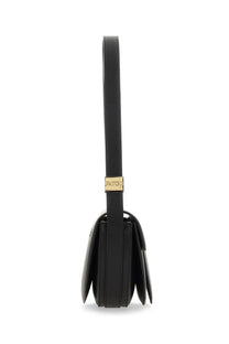 Black leather shoulder bag for women by patou featuring a gold-tone patou plaque on the strap