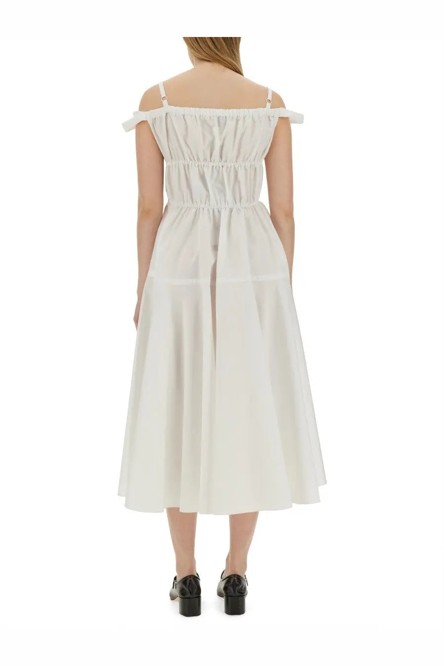 Patou women’s long white off-the-shoulder midi dress with gathered bodice and thin straps visible from the back