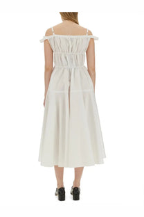 Patou women’s long white off-the-shoulder midi dress with gathered bodice and thin straps visible from the back