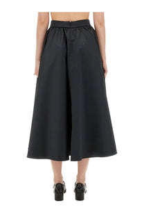 Patou women’s black high-waisted maxi skirt with wide-leg cut smooth slightly glossy fabric and subtle front seam detail