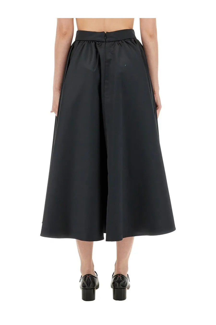 Patou women’s black high-waisted maxi skirt with wide-leg cut smooth slightly glossy fabric and subtle front seam detail