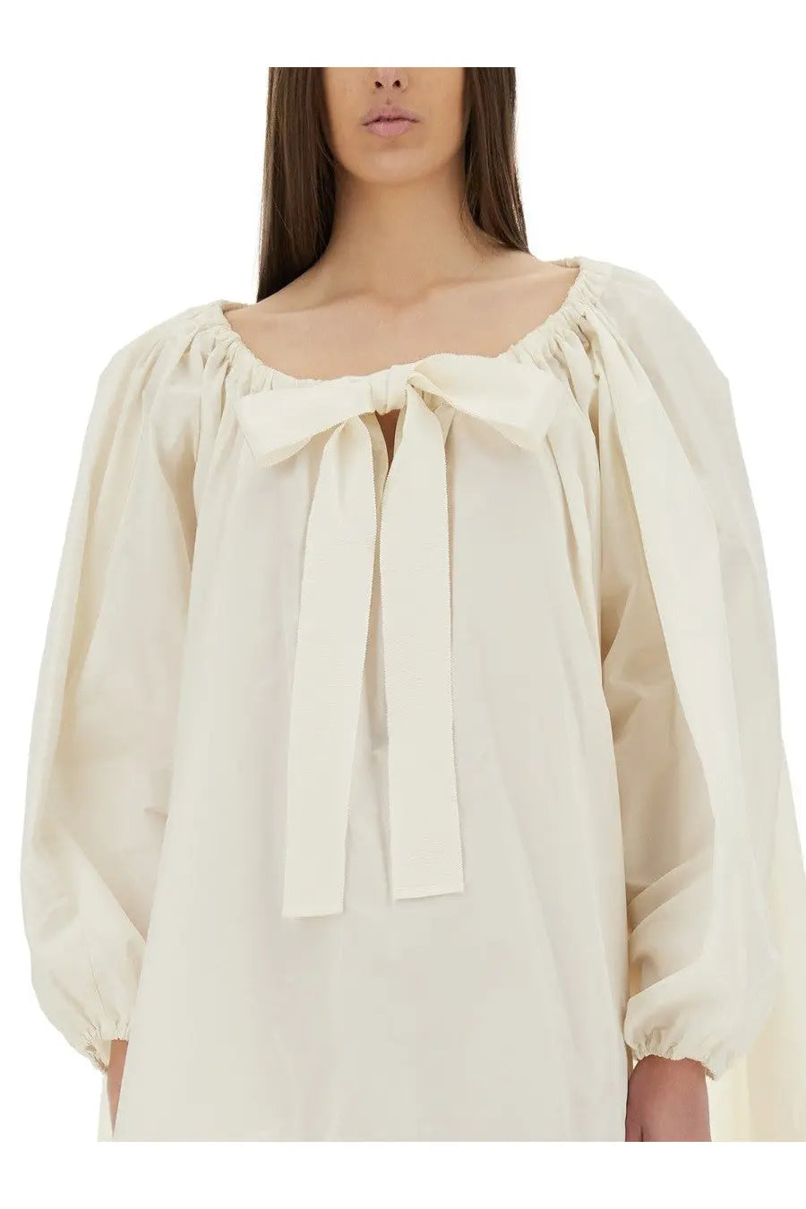 Cream-colored blouse with puffed sleeves and gathered square neckline with central bow from patou women’s ruffle hem dress white