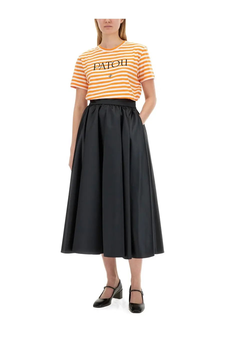 Black satin high waist midi skirt with full flowing silhouette paired with patou women’s multicolor shirt