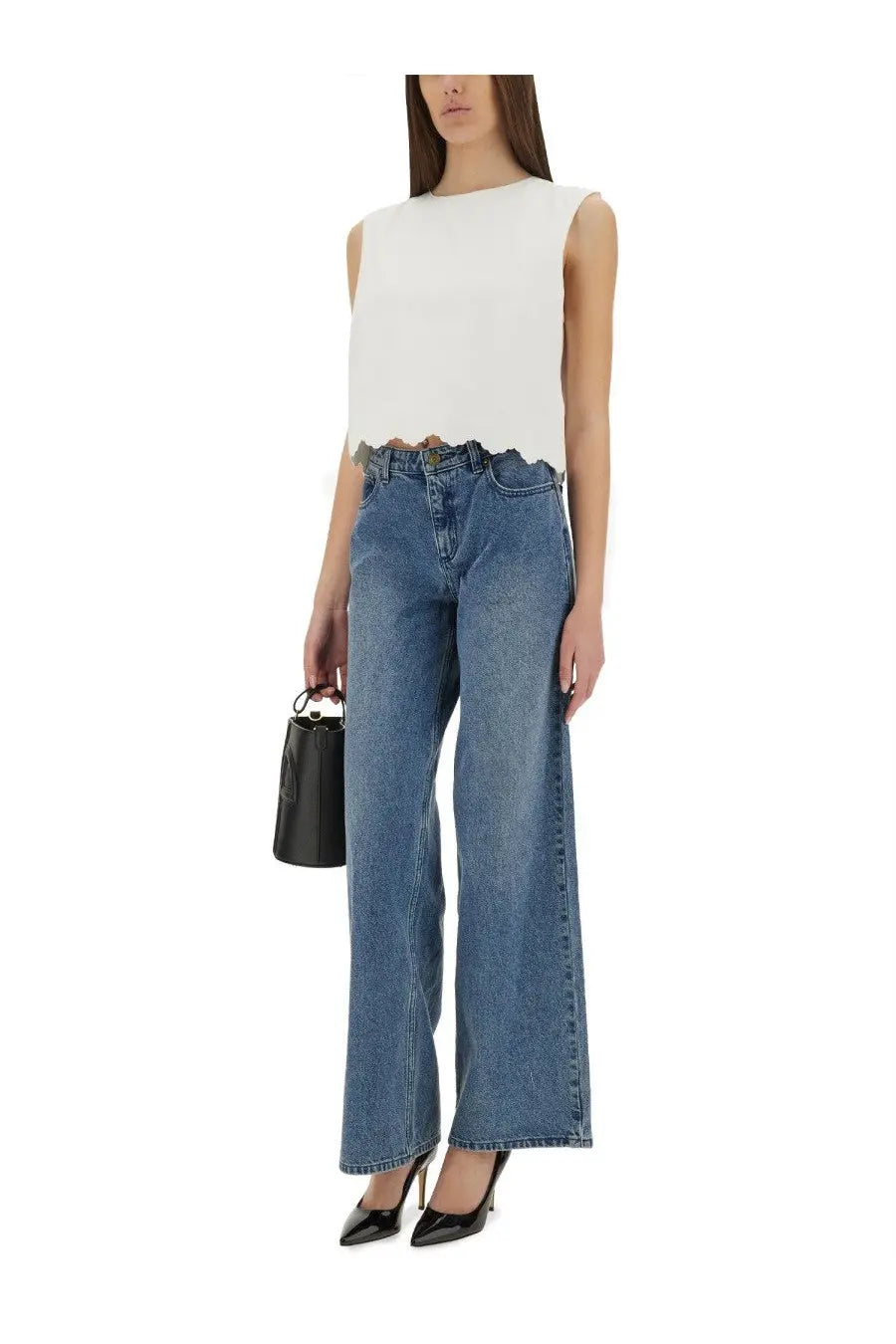 Patou women’s short poplin top white paired with blue denim wide-leg jeans featuring a frayed hem and classic five-pocket design