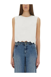 Patou women’s white sleeveless poplin top with cropped scalloped hemline for summer wear