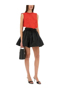 Patou women’s top annoded red black leather bucket bag with top handle and structured shape