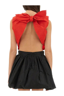 Back view of patou womens vibrant red sleeveless top with large bow and open-back design