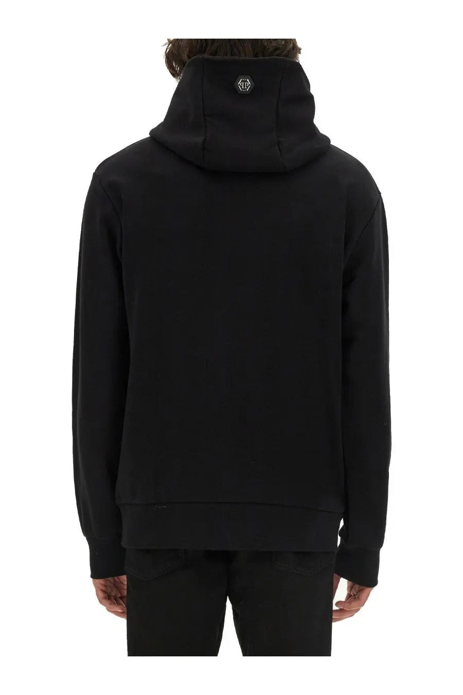 Back side of philipp plein men’s black hooded sweatshirt with a subtle logo patch on the collar in cotton material
