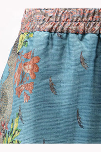 Pierre-Louis Mascia women’s silk trousers blue with teal ribbed texture and intricate orange green brown floral waistband pattern