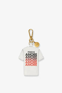 White leather keychain shaped like a t-shirt with pinko is amore text and gold-tone metal clasp by Pinko women