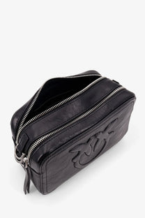 Pinko women’s carrie black leather travel bag with silver zippers and debossed logo on the side