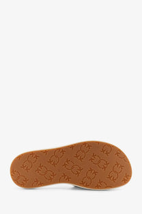 Tan rubber sole with embossed repeating logo pattern on pinko women’s fiona leather sandals white