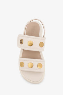 Pinko women’s fiona low white leather sandals with gold-tone circular studs and logo emblem on the strap