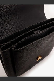 Pinko women’s black leather crossbody bag with pebbled texture and gold-tone circular clasp