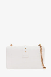 Pinko women’s white leather shoulder bag with gold-tone chain strap and three matching studs on the flap