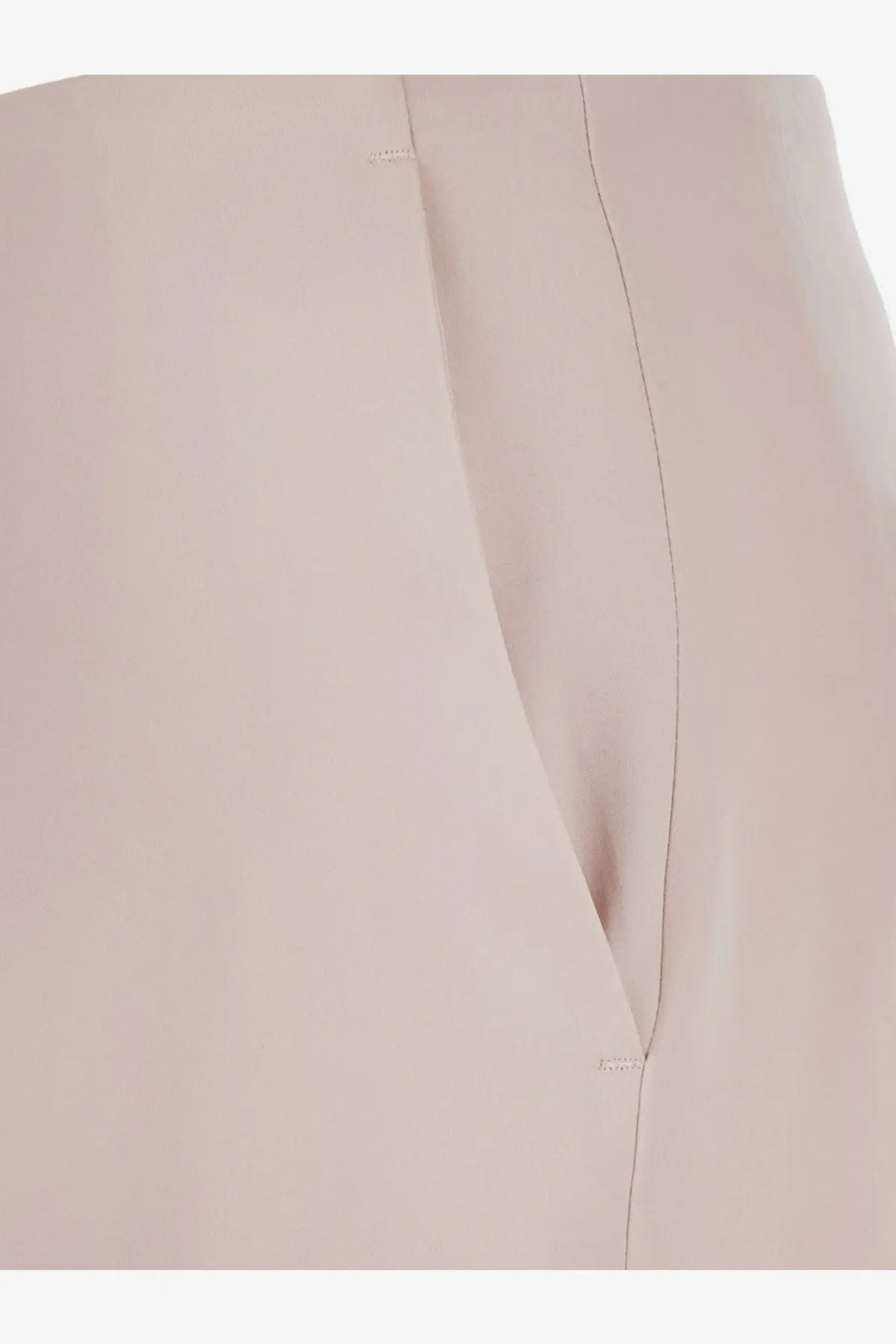 A close-up of pinko women’s limoncello satin trousers in pale pink fabric with subtle vertical stitching and gentle folds