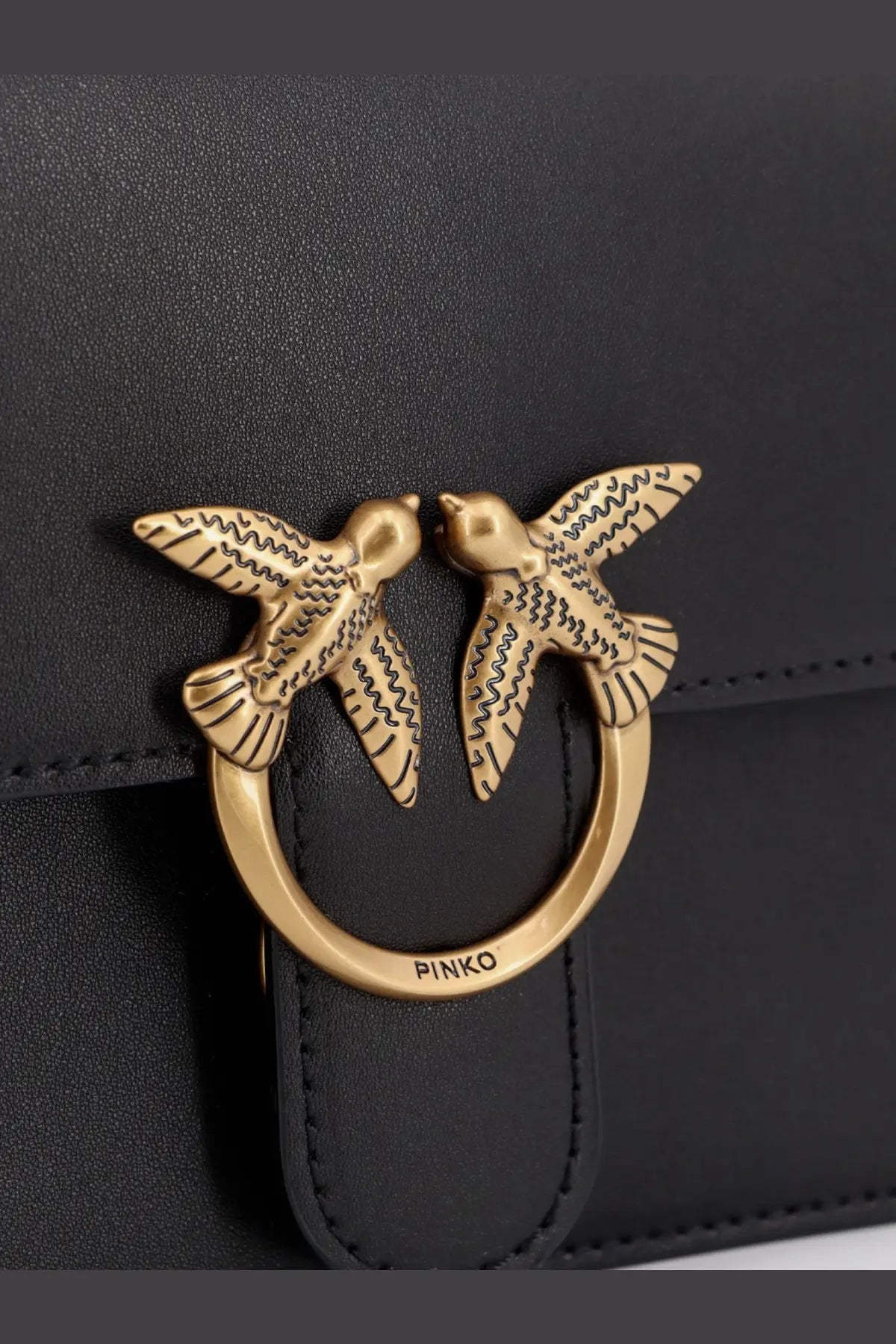 Pinko womens love one leather crossbody bag black with gold toned bird clasp and intricate wing detailing on front