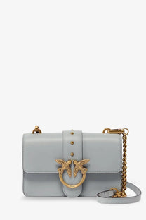 Pinko women’s love one mini leather crossbody bag in light blue with gold-tone bird clasp and chain strap