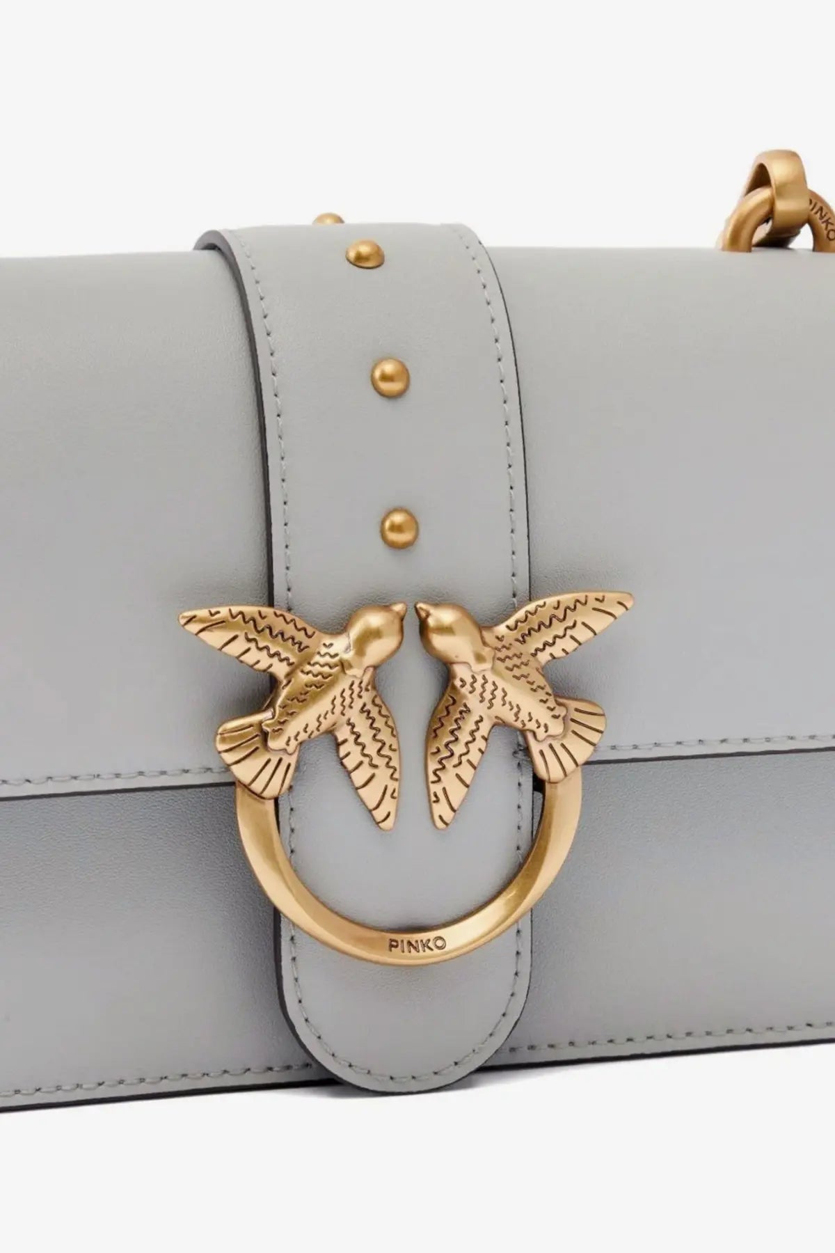 Pinko women’s love one mini grey leather crossbody bag with a gold-tone metal clasp featuring two interlocking birds