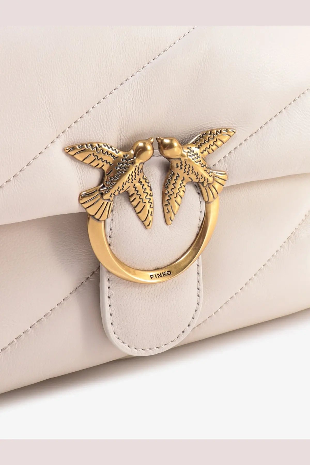 Pinko women’s white cream-colored quilted leather shoulder bag with gold-tone clasp featuring two detailed birds