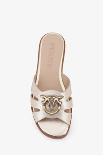 Pinko women’s milly leather slide sandal in metallic gold with bird-shaped buckle and cut-out straps