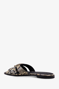 Pinko women’s Milly low leather sandals featuring snake-print slide design with black straps and a minimalist style